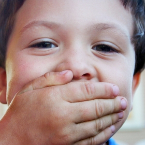 Kid Covering his mouth