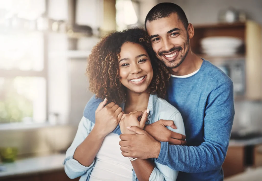 a young couple both smiling